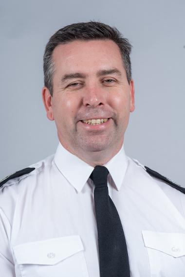 Photograph of Scott Norman in uniform with tie portrait