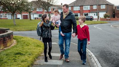 Man and three children