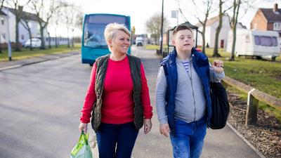 Woman and young man walking