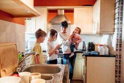 Parent and children in kitchen