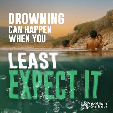 Photo of children outdoors in shallow water. Words on top of the image read 'DROWNING CAN HAPPEN WHEN YOU LEAST EXPECT IT'. WHO logo displayed.