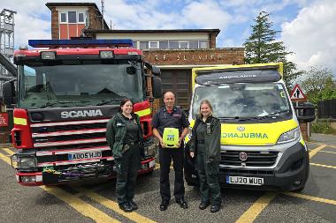 Photograph of Chris Baker and EEAST colleagues outside Aylsham Fire Station