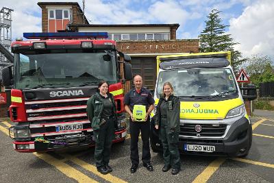 Photograph of Chris Baker and EEAST colleagues outside Aylsham Fire Station