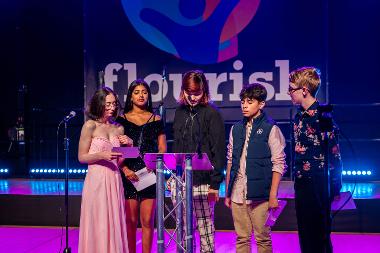 Four young comperes of the awards ceremony on stage