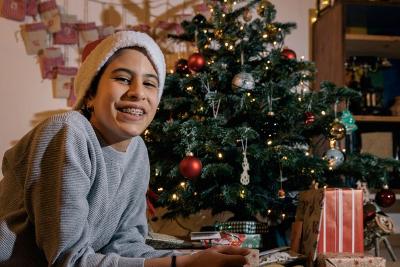 Teenager in a Christmas setting